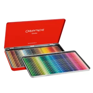 A Set of 80 Caran D'Ache Supracolor Pencils is shown with the hinged lid open, in the center of the frame horizontally. The pencils are encased in a red tin with the Caran D'Ache name printed on the inside of the tin lid. The pencils are lined up neatly next to each other in the base of the tin. Each pencil is a different colour and the pencil barrels reflect the colour of the pencil lead. On a white background.
