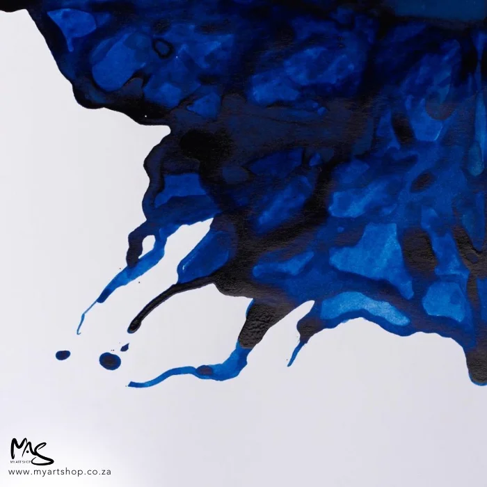 ultramarine-winsor-and-newton-drawing-ink-14ml-02 There is ink from the Ultramarine Winsor & Newton Drawing Ink bottle flowing in from the top right hand corner of the frame, into the center of the frame.