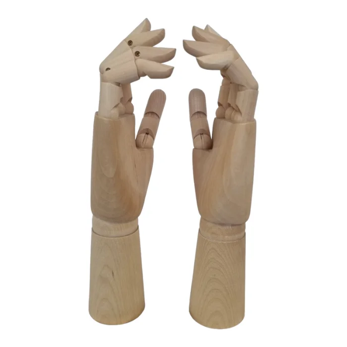 prime-art-hand-manikin-05 There are two Prime Art Hand Manikins shown in the frame. A left hand, and a right hand. They are wooden, jointed manikins. On a white background.