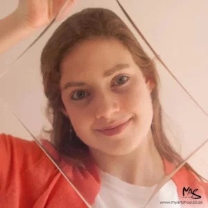 A loose 8" x 10" Gelli Arts Printing Plate with NO PACKAGING is seen being held up in front of a young girls face.