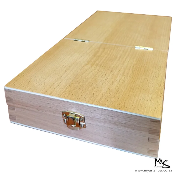 wooden-paint-brush-box-03 A close up of the clasp of a Wooden Paint Brush Box. The box is shown diagonally across the frame and the clasp is shown at the front of the frame. The box is brown and is on a white background.