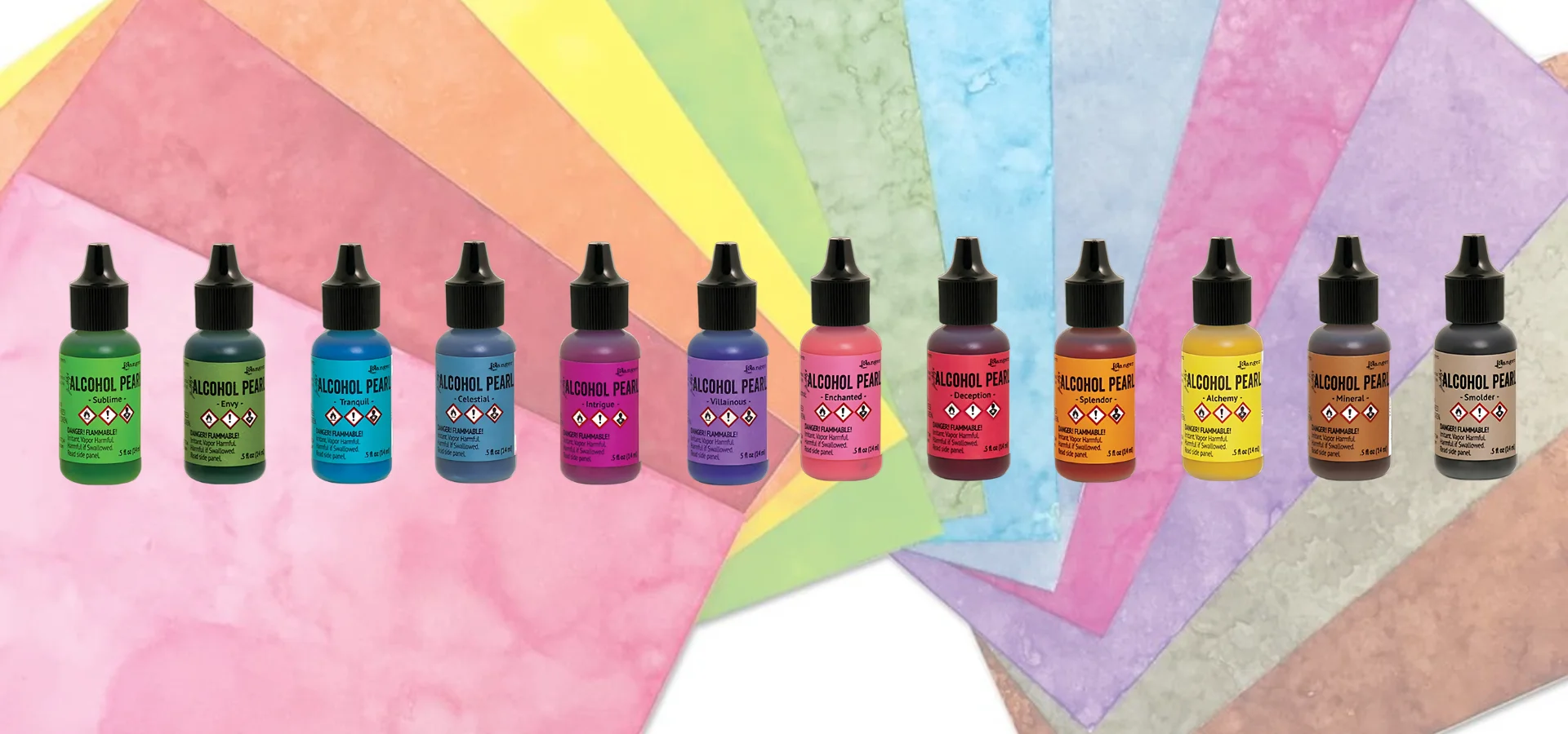 alcohol-inks-pearls-by-ranger-pearls-of-wisdom. in the center of the image is a straight line of the alcohol pearls. they are in a colour order in the center of the image. they are clear bottles with a coloured label that matches to the colour of ink inside the bottle. they have black lids. they are on a colour swatch background made of the colours put onto yupo paper. that has been made to be slightly transparent.