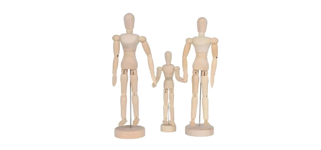 There are 3 wooden Prime Art Manikins in the frame. The two on either side are much larger than the one in the center. They are all facing frontwards and are all jointed. On a white background. they are all sold at my art shop