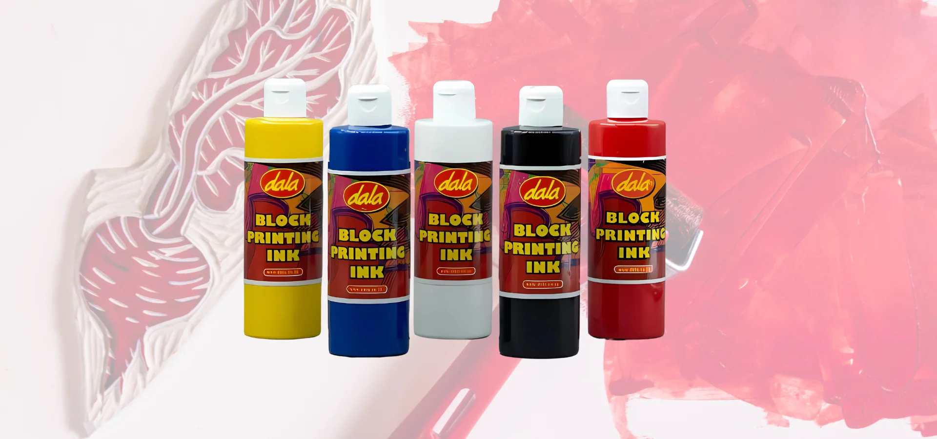 dala-block-printing-inks-demystified shows in this image a row of the dala inks . from left to right. yellow, blue, white, black and then red. all are clear bottles showing the colour inside of them. their caps are white and their labels are in the center of the bottle and wrap all the way around. they are sitting in front of a faint image of a rubber stamp and a brayer. that is covered in a red paint.