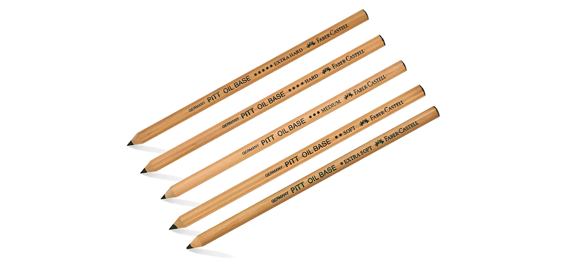Faber-Castell Pitt Oil Pencils from Drab to Fab. the five pencils are at an angle in the image. their nibs are pointing towards the bottom left corner of the image. they are all brown wood cased pencils. they have black writing on them describing what they are and the brand name. they all have sharp black nibs. there is a shadow underneath them as if the light is coming from above. they are on a white background