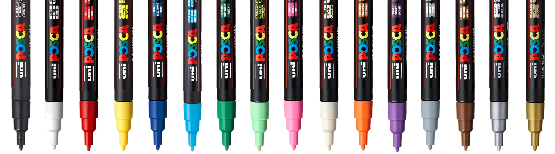 posca-paint-pens-fine-tip-markers-edition. across the image the posca pens are in a row nib facing down, the name is clear on the fron to f it. the tips are all different colours. the background is white. they are lined up in a colourful rainbow fashion across the whole of the image
