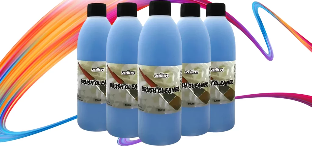 Zellen Brush Cleaner 500ml. The bottle is a clear plastic bottle and you can see the blue brush cleaner in the bottle. The lid is black and the bottles are stacked in the centre of the image. there are 5 bottles. 1 in the front and two on each side going backwards. they are in front of a rainbow squiggle on a White background