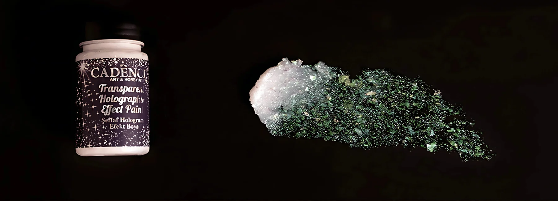 cadence-effect-paints-demystified. the background of the image is black. on the left hand side is the holographic paint. it is a white bottle with a purple label with sparkle on it and a black lid. to the right is a smear of the paint showing off all the crystals and glitter in the paint