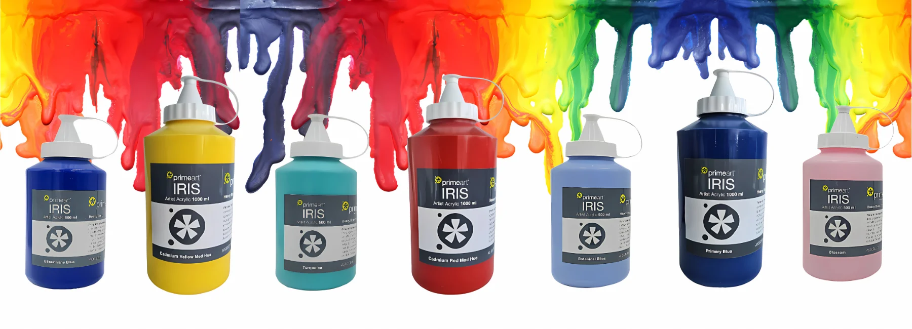 iris-acrylic-paint-tickle-your-palette. across the centre of the image are alternating sizes of 500ml and 1 litre iris acrylic paints in shades of blue and red and yellow. they are clear bottles with white caps. they are sitting beneath a rainbow paint drip that runs along the top of the screen
