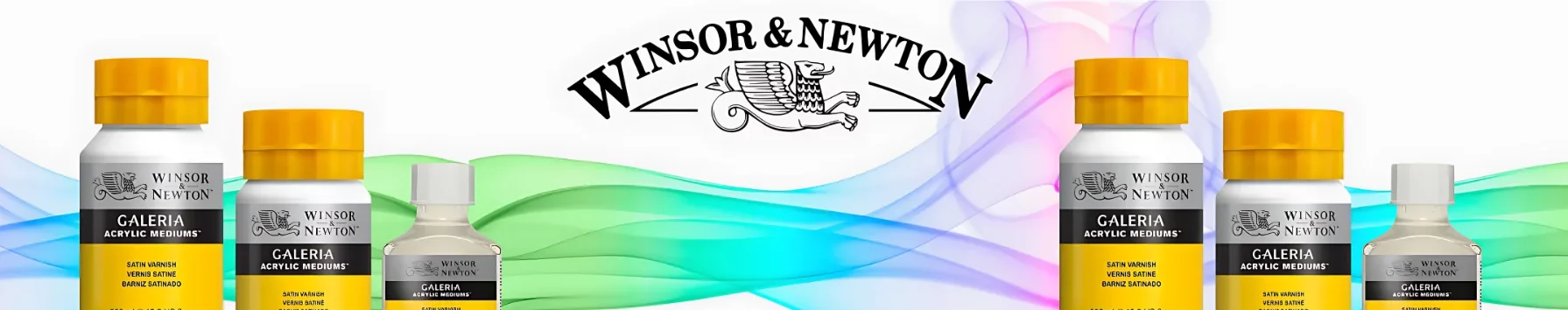 winsor-newton-acrylic-mediums-an-artistry. on either side of the image are three winsor and newton acrylic mediums. a large tub a medium and a small tub. they all are white and have yellow and black labels. the two bigger ones have yellow lids while the smaller one has a white lid. they are on a flowing rainbow ribbon that is running across the whole image. in the center and raised up is the winsor and newton logo in black
