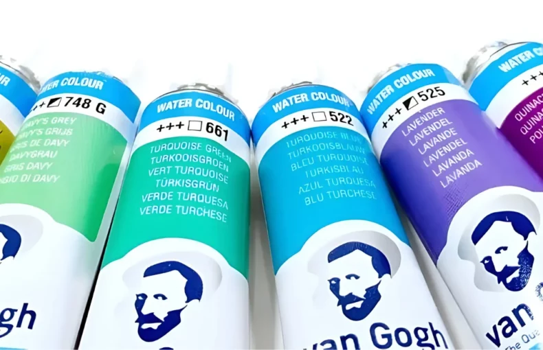 van-gogh-watercolour-tubes-a-creative-journey. the image is a close up of several van gogh watercolour tubes. they are all facing up and in a half moon shape. they are in a rainbow order. the name and colour clearly visable on it. on a white background