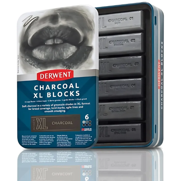 A single Set of 6 Derwent Charcoal XL Blocks is shown vertically in the center of the frame. The tin has a picture of a persons lips at the top of the tin and the bottom of the tin is blue with white text and has the details of the set printed on it. The Derwent logo is printed in red